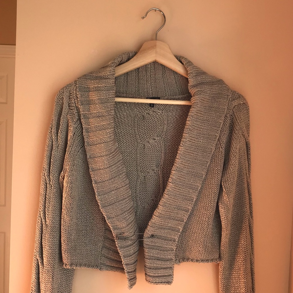 Beautiful knit crop cardigan for Fall with front ornamental pin.